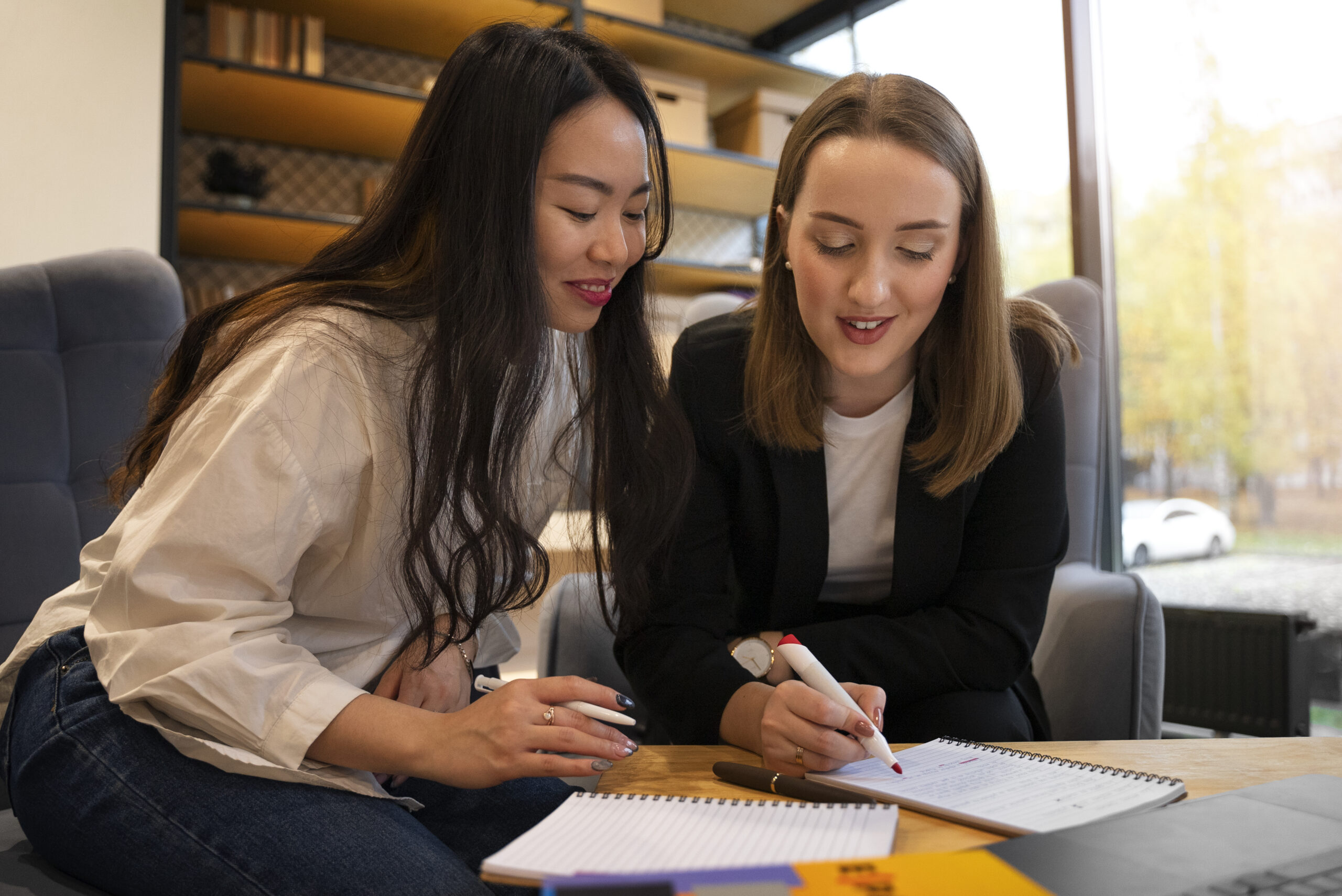 Women reviewing notes together